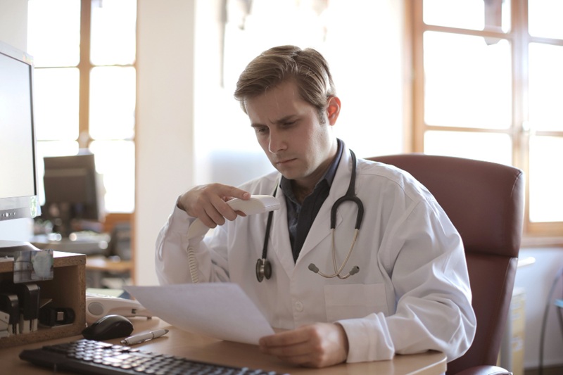 Medical expert reviewing hair transplant data in Spain